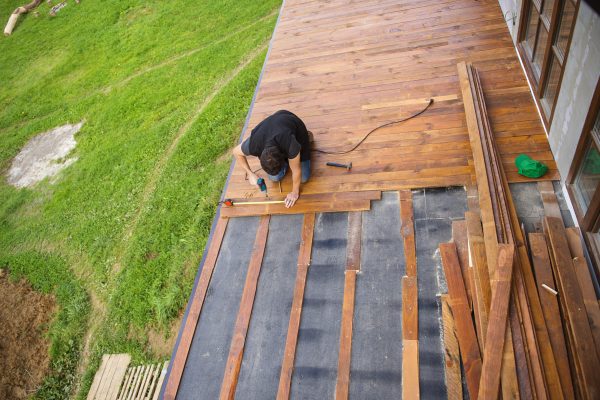 handyman-installing-wooden-flooring-in-patio-work-2025-10-01-08-33-09-utc